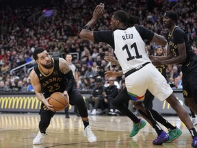 Toronto Raptors guard Fred VanVleet (23) looks to make a play against Minnesota Timberwolves center Naz Reid (11) during the second half at Scotiabank Arena.
