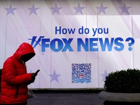 A person walks past the Fox News Headquarters at the News Corporation building in New York City, Thursday, March 9, 2023.