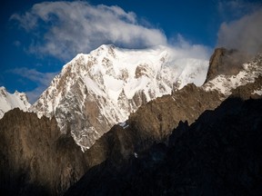 This picture taken in Courmayeur, in the Mont Blanc Massif, on Aug. 6, 2021 shows the Mont Blanc de Courmayeur (left) and the summit of Mont Blanc (centre).
