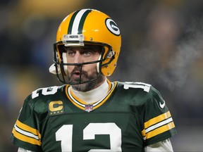 Aaron Rodgers of the Green Bay Packers warms up prior to the game against the Detroit Lions at Lambeau Field on January 08, 2023 in Green Bay, Wisconsin.
