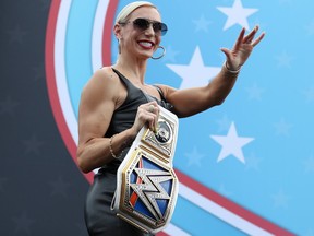 American professional wrestler Charlotte Flair walks onstage during pre-race ceremonies prior to during the NASCAR Cup Series 65th Annual Daytona 500 at Daytona International Speedway on February 19, 2023 in Daytona Beach, Florida. (Courtney Culbreath/Getty Images)