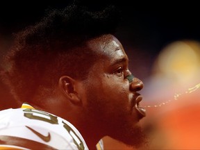 Nose tackle Letroy Guion of the Green Bay Packers spits on the sidelines prior to the game against the Detroit Lions at Ford Field on December 3, 2015 in Detroit, Michigan.