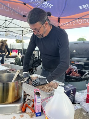 Dave Grohl cooking for hundreds of people at a homeless shelter.