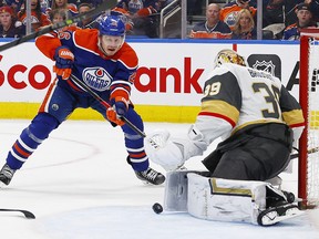 Mar 25, 2023; Edmonton, Alberta, CAN; Vegas Golden Knights goaltender Laurent Brossoit (39) makes a save on Edmonton Oilers forward Mattias Janmark (26) during the third period at Rogers Place.