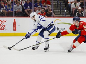Toronto Maple Leafs centre Calle Jarnkrok (19) moves the puck ahead of Florida Panthers centre Anton Lundell (15) during the first period at FLA Live Arena March 23, 2023.