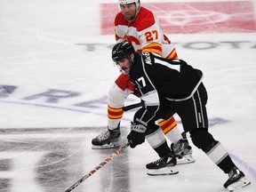 Mar 20, 2023; Los Angeles, California, USA; Los Angeles Kings center Zack MacEwen (17) skates during third period against Calgary Flames left wing Nick Ritchie (27) at Crypto.com Arena.
