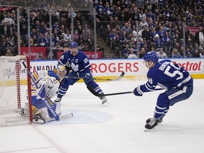 Buffalo Sabres goaltender Craig Anderson (41) and Toronto Maple Leafs forward John Tavares (91) watch a shot by  forward Michael Bunting (58) go wide of the net during the third period at Scotiabank Arena March 13, 2023.