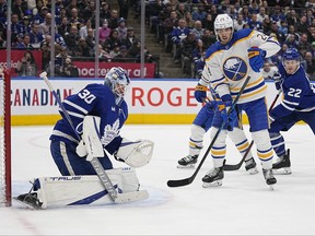 Toronto Maple Leafs goaltender Matt Murray (30) goes to make a save as Buffalo Sabres forward Dylan Cozens (24) looks for a rebound during the second period at Scotiabank Arena March 13, 2023.