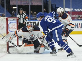 Jan 5, 2022; Toronto, Ontario, CAN; Toronto Maple Leafs forward John Tavares (91) scores on Edmonton Oilers goaltender Mike Smith (41) during the first period at Scotiabank Arena. John E. Sokolowski-USA TODAY Sports