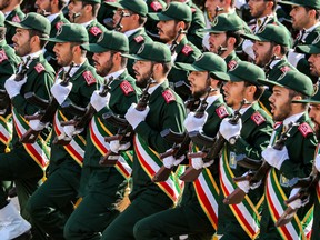 (FILES) In this file photo taken on September 22, 2018 members of Iran's Revolutionary Guards Corps (IRGC) march during the annual military parade marking the anniversary of the outbreak of the devastating 1980-1988 war with Saddam Hussein's Iraq, in the capital Tehran. - President Donald Trump on April 8, 2019 announced the United States is designating Iran's elite military force, the Islamic Revolutionary Guard Corps, a terrorist organization. Trump said in a statement that the "unprecedented" move "recognizes the reality that Iran is not only a State Sponsor of Terrorism, but that the IRGC actively participates in, finances, and promotes terrorism as a tool of statecraft." (Photo by STRINGER / AFP)STRINGER/AFP/Getty Images ORG XMIT: POS2019040815065976