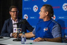 Toronto Blue Jays manager John Gibbons (right) and general manager Ross Atkins shake hands after addressing media before the game against the Houston Astros at the Rogers Centre in Toronto, Ont. on Wednesday September 26, 2018. They both confirmed this will be his last season as manager. Ernest Doroszuk/Toronto Sun