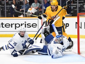 Maple Leafs goaltender Joseph Woll (60) makes a save during the third period against the Nashville Predators at Bridgestone Arena on Sunday night.