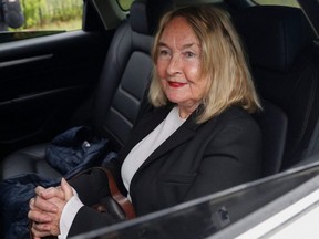 Reva Steenkamp's mother, June Steenkamp, smiles as she arrives at Atteridgeville Correctional Center in Pretoria, South Africa, Friday, March 31, 2023.