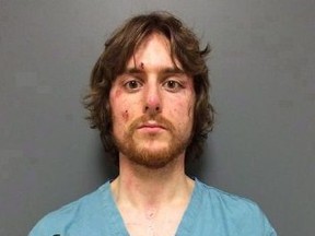 Justin Bourque is shown in this RCMP booking photo taken June 6, 2014.