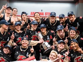 The Six celebrating with Isobel Cup after championship win.
