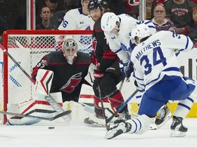 Toronto Maple Leafs centre Auston Matthews (34) takes a shot at Carolina Hurricanes goaltender Pyotr Kochetkov (52) during the first period at PNC Arena.