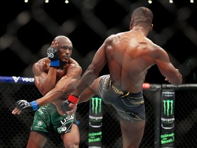 Kamaru Usman is kicked by Leon Edwards during the Welterweight Title Bout between Leon Edwards and Kamaru Usman at The O2 Arena on March 18, 2023 in London.