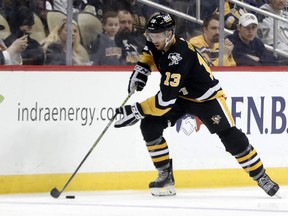 Pittsburgh Penguins centre Nick Bonino moves the puck against the New York Islanders during the third period at PPG Paints Arena in Pittsburgh, Pa., March 9, 2023.