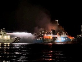 Philippine Coast Guard respond to the fire incident onboard M/V LADY MARY JOY 3 at the waters off Baluk-Baluk Island, Hadji Muhtamad, Basilan, Philippines, March 29, 2023.