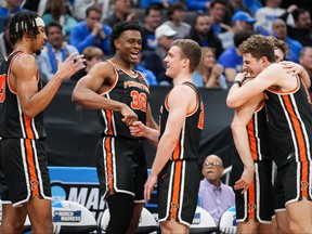 The Princeton Tigers react as substitutions are made late during the second half prior to defeating the Missouri Tigers at Golden 1 Center.