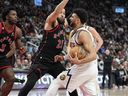 Toronto Raptors forward O.G. Anunoby (3) and guard Fred VanVleet (23) defend against Denver Nuggets guard Jamal Murray (27) during the second half at Scotiabank Arena. 