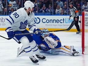 Ryan O'Reilly of the Toronto Maple Leafs scores against Ukko-Pekka Luukkonen of the Buffalo Sabres during a game at KeyBank Center on February 21, 2023 in Buffalo.