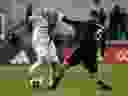 Feb 25, 2023; Washington, District of Columbia, USA;  Toronto FC midfielder Federico Bernardeschi (10) kicks the ball past D.C. United defender Mohanad Jeahze (5) during the first half at Audi Field.  