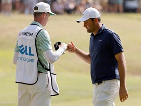 Scottie Scheffler and caddie Ted Scott on the ninth green during Day 5 of the World Golf Championships-Dell Technologies Match Play at Austin Country Club on Austin, Texas on Sunday.