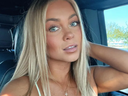 Golf influencers Hailey Ostrom (pictured) and Paige Spiranac are feuding over Tiger Woods.