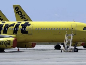 A Spirit Airlines jets sit on the tarmac at the Orlando International Airport on May 20, 2020, in Orlando, Fla. CHRIS O'MEARA /THE ASSOCIATED PRESS