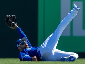 Toronto Blue Jays centre fielder Kevin Kiermaier makes a diving catch against the Baltimore Orioles in the fourth inning during spring training at TD Ballpark on March 11, 2023.