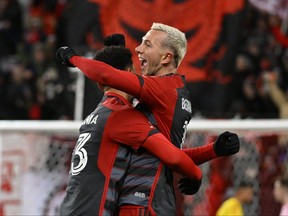 Toronto FC midfielder Federico Bernardeschi (10) celebrates with midfielder Brandon Servania (23) after helping to set up a goal against Inter Miami in the second half at BMO Field.