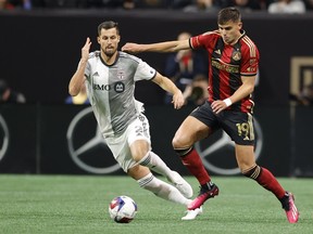 TFC defender Matt Hedges (left) and Atlanta United forward Miguel Berry battle for the ball in Atlanta on Saturday night.