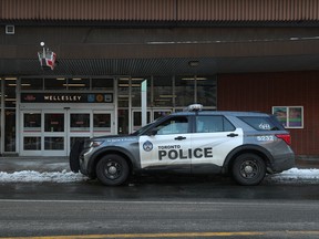 A Toronto Police cruiser is parked outside Wellesley subway station.