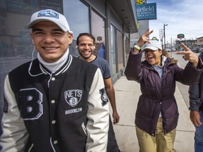 After entering Canada at Roxham Rd, an irregular border crossing in Quebec, Lorey, from Colombia (middle), goes out for a walk with other asylum seekers, who are some of the thousands that have been transported to hotels in Niagara Falls, Ont., out for a walk on Friday, March 24, 2023.