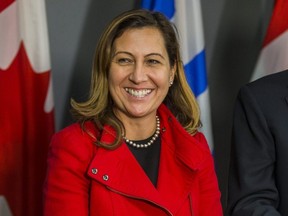 Ana Bailao smiles during a news conference.