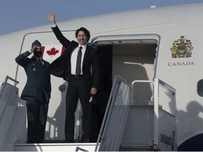 Prime Minister Justin Trudeau waves as he boards a government plane at the airport in Ottawa, on June 10, 2021. PHOTO BY ADRIAN WYLD /The Canadian Press