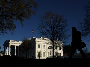 A person walks away from the White House in Washington, U.S., March 8, 2023. REUTERS/Leah Millis