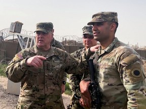 In this file photo taken on March 4, 2023, U.S. Joint Chiefs Chair Army General Mark Milley speaks with U.S. forces in Syria during an unannounced visit at a U.S. military base in Northeast Syria.