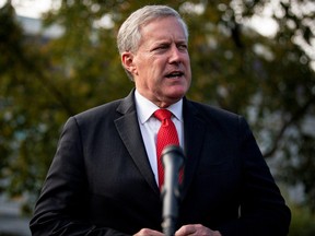 White House Chief of Staff Mark Meadows speaks to reporters following a television interview, outside the White House in Washington, Oct. 21, 2020.