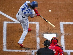 Sep 9, 2022; Arlington, Texas, USA; Toronto Blue Jays first baseman Vladimir Guerrero Jr. (27) hits a single against the Texas Rangers during the first inning at the Globe Life Field.