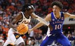 Oklahoma State Cowboys guard Caleb Asberry (5) tries to get past Kansas Jayhawks forward Jalen Wilson (10) during a men's college basketball game between the Oklahoma State University Cowboys and the Kansas Jayhawks at Gallagher-Iba Arena in Stillwater, Okla., Tuesday, Feb. 14, 2023.