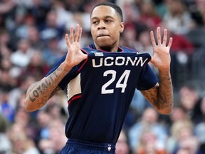 Mar 25, 2023; Las Vegas, NV, USA; Connecticut Huskies guard Jordan Hawkins (24) reacts against the Gonzaga Bulldogs during the second half for the NCAA tournament West Regional final at T-Mobile Arena.