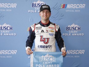 William Byron, driver of the #24 Liberty University Chevrolet, poses for photos after winning the pole award during qualifying for the NASCAR Cup Series EchoPark Automotive Grand Prix at Circuit of The Americas on March 25, 2023 in Austin, Texas.