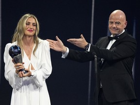 Spain's Alexia Putellas receives the Best FIFA Women's player award from FIFA president Gianni Infantino during the ceremony of the Best FIFA Football Awards in Paris, France, Monday, Feb. 27, 2023.