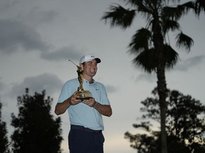 Scottie Scheffler celebrates after winning The Players Championship golf tournament, Sunday, March 12, 2023, in Ponte Vedra Beach, Fla.