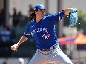 Mar 20, 2023; Lakeland, Florida, USA; Toronto Blue Jays starting pitcher Kevin Gausman throws a pitch against the Detroit Tigers during the first inning at Publix Field at Joker Marchant Stadium.