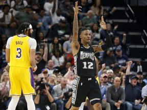 Feb 28, 2023; Memphis, Tennessee, USA; Memphis Grizzlies guard Ja Morant reacts during the second half against the Los Angeles Lakers at FedExForum.