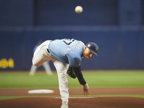 Tampa Bay Rays starting pitcher Drew Rasmussen throws in the first inning of a spring training baseball game against the Toronto Blue Jays in St. Petersburg, Fla., Sunday, March 19, 2023.