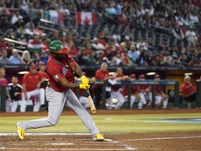 Mexico's Randy Arozarena hits an RBI double against Canada during the second inning of a World Baseball Classic game in Phoenix, Wednesday, March 15, 2023.